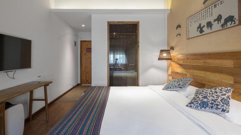 Imagen de la habitación del Hotel TONGXIANG WUZHEN YUEXIANG INN, Huangjiadi. Foto 5