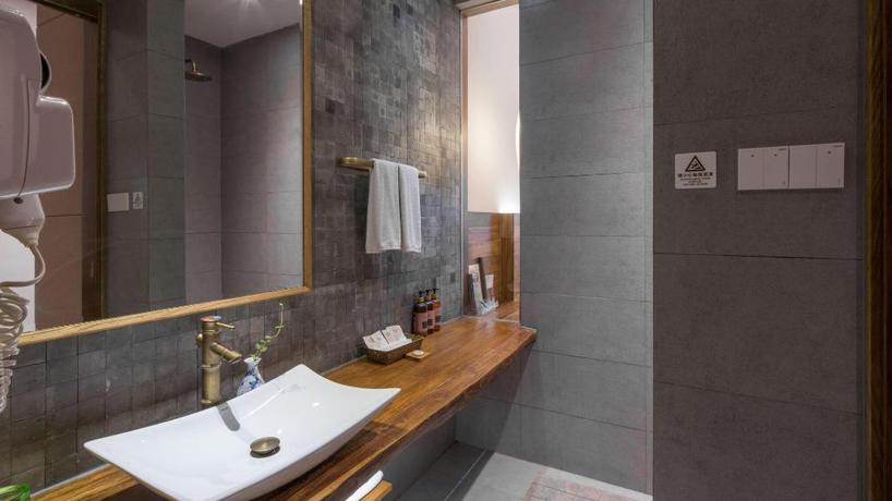 Imagen de la habitación del Hotel TONGXIANG WUZHEN YUEXIANG INN, Huangjiadi. Foto 9