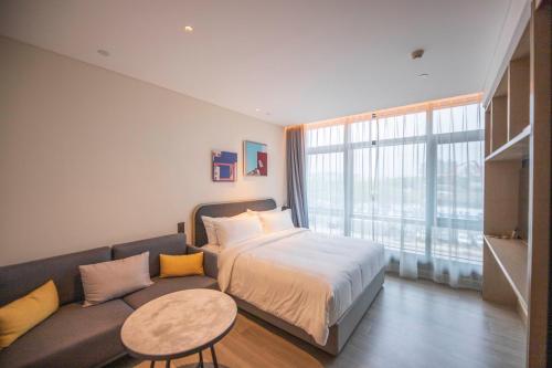 Imagen de la habitación del Hotel TOP Residences Shanghai. Foto 17
