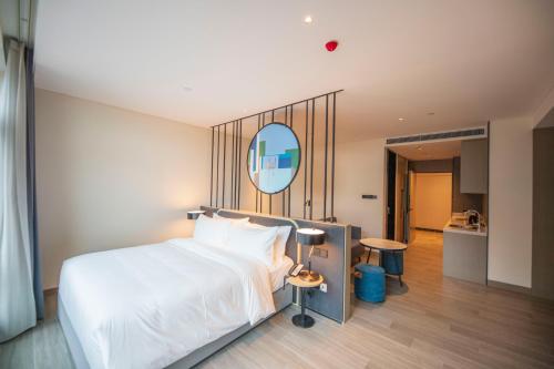 Imagen de la habitación del Hotel TOP Residences Shanghai. Foto 18