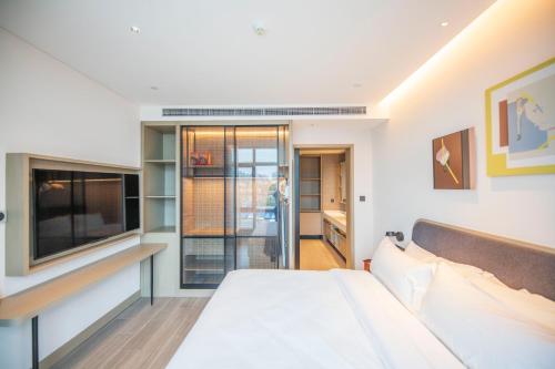 Imagen de la habitación del Hotel TOP Residences Shanghai. Foto 19