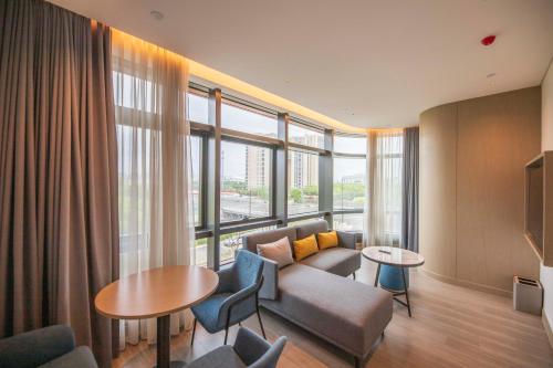 Imagen de la habitación del Hotel TOP Residences Shanghai. Foto 20