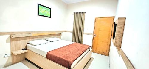 Imagen de la habitación del Hotel TOS Cemara Hijau. Foto 19