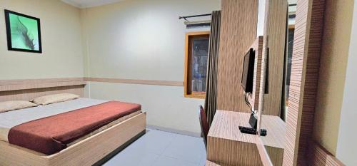 Imagen de la habitación del Hotel TOS Cemara Hijau. Foto 20
