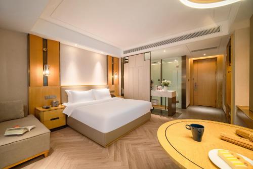 Imagen de la habitación del Hotel TOWO Shangpin International. Foto 16