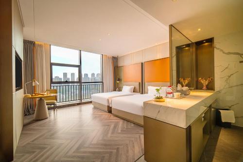Imagen de la habitación del Hotel TOWO Shangpin International. Foto 17