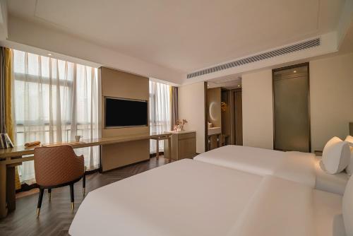 Imagen general del Hotel TOWO Shangpin International. Foto 12