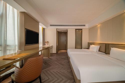 Imagen de la habitación del Hotel TOWO Shangpin International. Foto 20