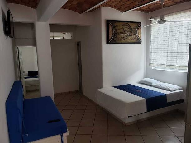 Imagen de la habitación del Hotel TROPICAL SUITE. Foto 15