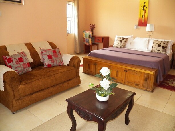 Imagen de la habitación del Hotel TS Lodgings. Foto 18