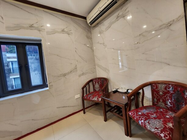 Imagen de la habitación del Hotel TUAN CENTRAL HOTEL. Foto 16