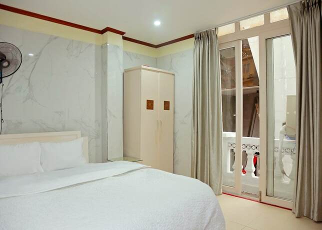 Imagen de la habitación del Hotel TUAN CENTRAL HOTEL. Foto 17
