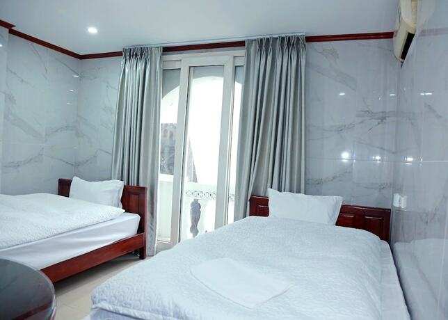 Imagen de la habitación del Hotel TUAN CENTRAL HOTEL. Foto 19