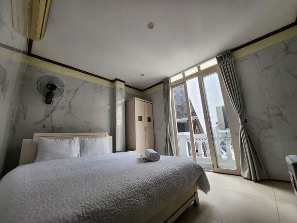 Imagen de la habitación del Hotel TUAN CENTRAL HOTEL. Foto 20
