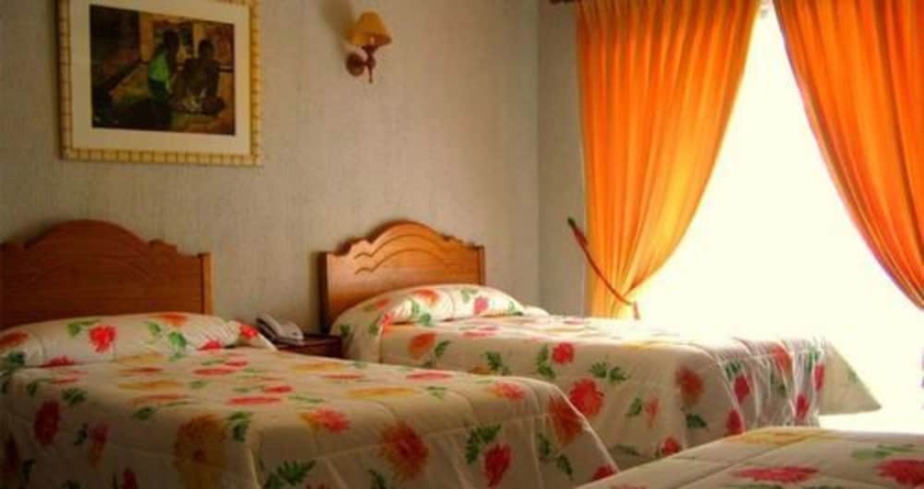 Imagen de la habitación del Hotel Taha Tai. Foto 8