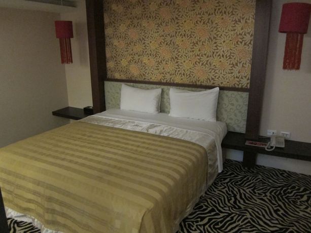 Imagen de la habitación del Hotel Tai Lee. Foto 7