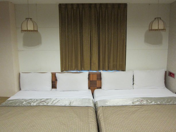 Imagen de la habitación del Hotel Tai Lee. Foto 9