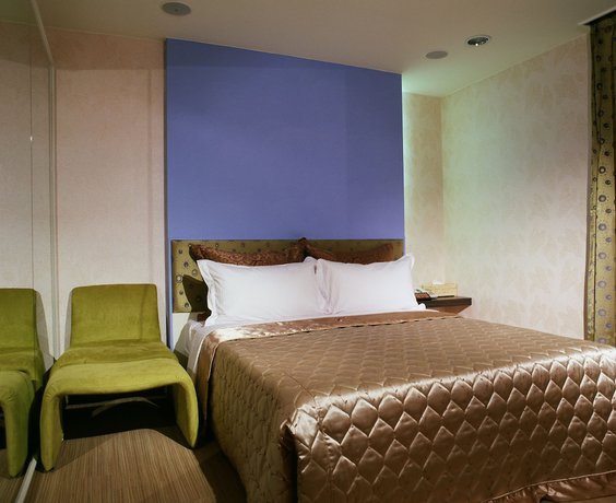 Imagen de la habitación del Hotel Tai Lee. Foto 14