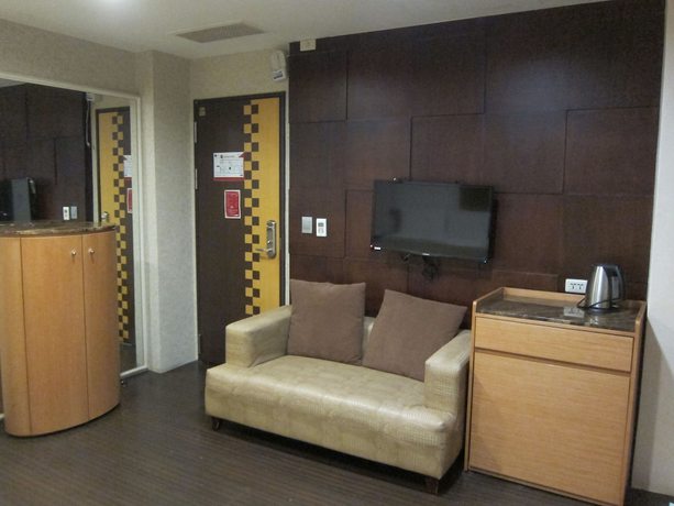 Imagen de la habitación del Hotel Tai Lee. Foto 15