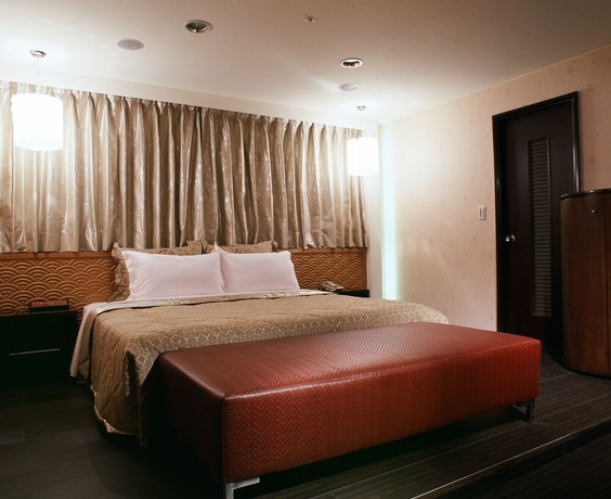 Imagen de la habitación del Hotel Tai Lee. Foto 16