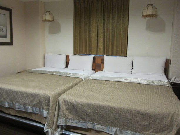 Imagen de la habitación del Hotel Tai Lee. Foto 17