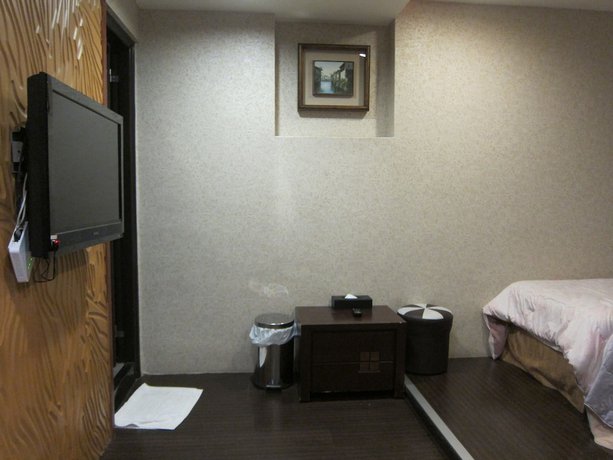 Imagen de la habitación del Hotel Tai Lee. Foto 19
