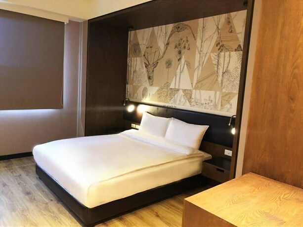 Imagen de la habitación del Hotel Taichung Easylazy Inn. Foto 15