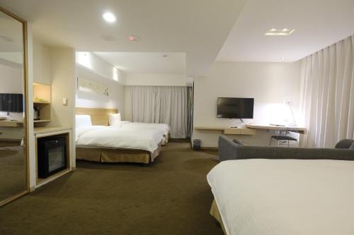 Imagen de la habitación del Hotel Taichung Feng Chia Beacon. Foto 6