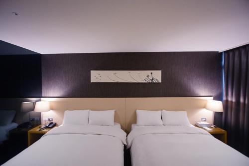 Imagen de la habitación del Hotel Taichung Feng Chia Beacon. Foto 10