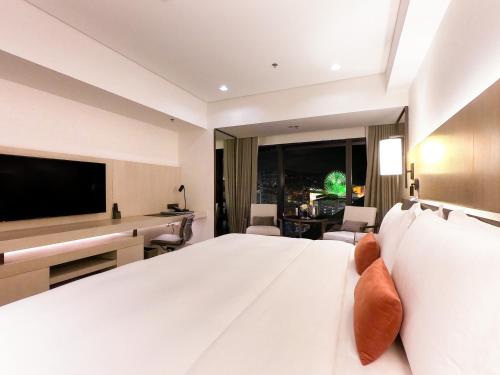 Imagen de la habitación del Hotel Taipei Marriott. Foto 5