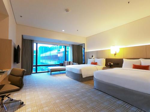Imagen de la habitación del Hotel Taipei Marriott. Foto 6