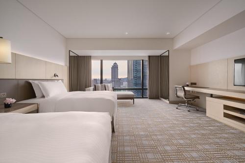 Imagen de la habitación del Hotel Taipei Marriott. Foto 8