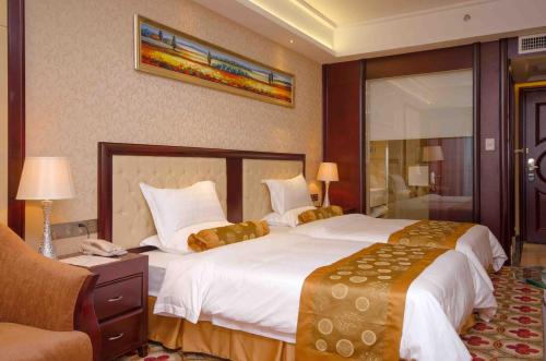 Imagen de la habitación del Hotel Taishan Jie'aosi International. Foto 4