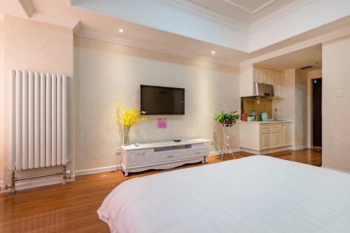 Imagen de la habitación del Hotel Taishan Shell Apartment. Foto 18