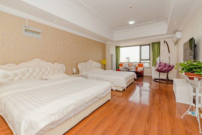 Imagen de la habitación del Hotel Taishan Shell Apartment. Foto 36