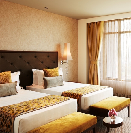 Imagen de la habitación del Hotel Taj Swarna. Foto 8