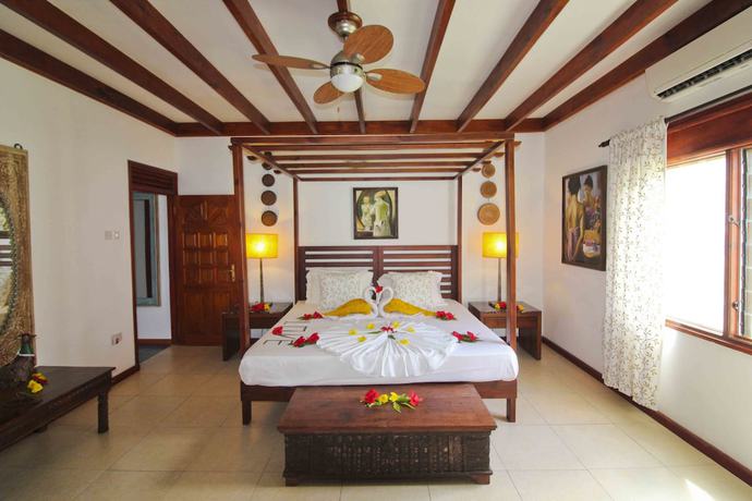Imagen de la habitación del Hotel Takamaka Green Village. Foto 13
