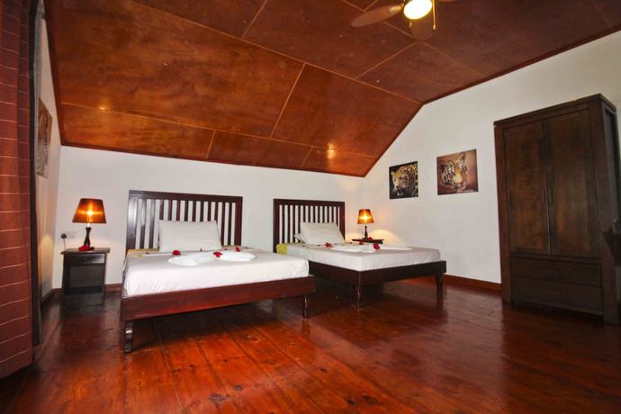 Imagen de la habitación del Hotel Takamaka Green Village. Foto 15