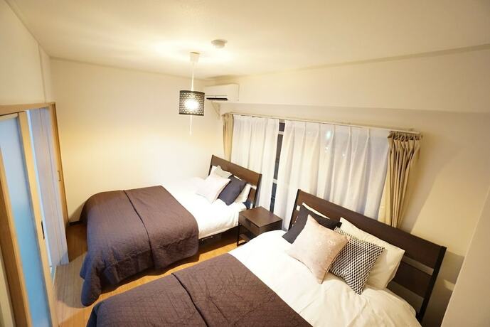 Imagen de la habitación del Hotel Takemura House Kyoubashi. Foto 22