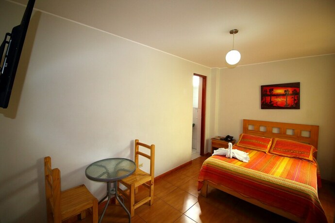 Imagen de la habitación del Hotel Takora Inn. Foto 19