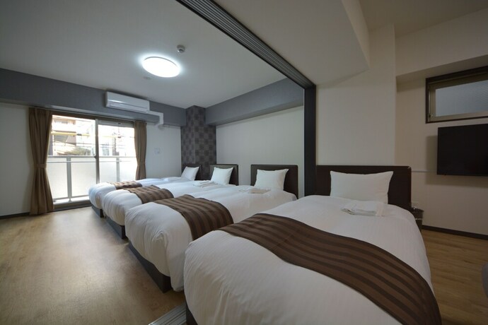 Imagen de la habitación del Hotel Takuto Stay Sakaisuji-honmachi. Foto 19