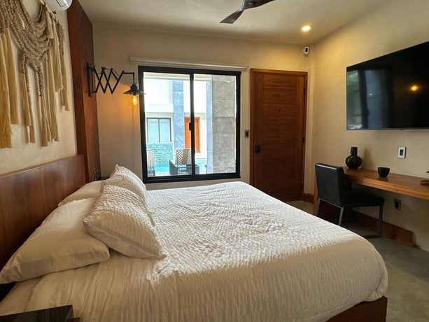 Imagen de la habitación del Hotel Talulah Living. Foto 13