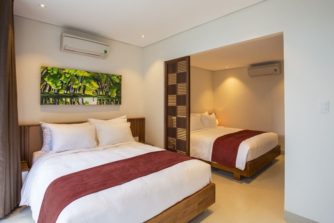 Imagen de la habitación del Hotel Tam House Villa. Foto 7