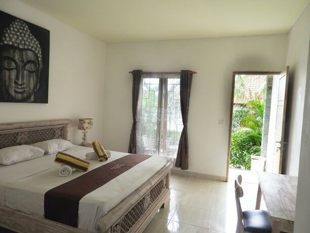Imagen de la habitación del Hotel Taman Asih Bingin Homestay. Foto 18