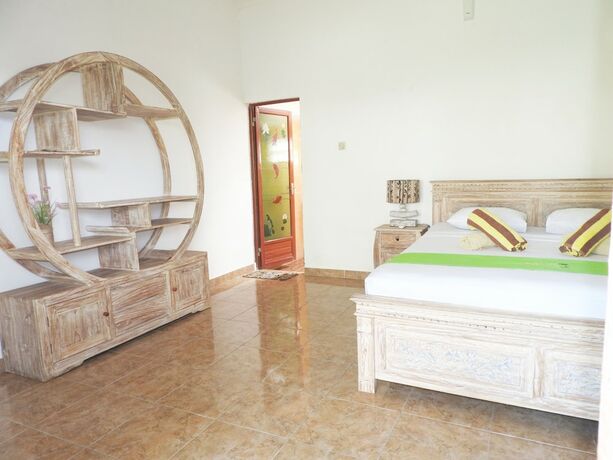 Imagen de la habitación del Hotel Taman Asih Bingin Homestay. Foto 19