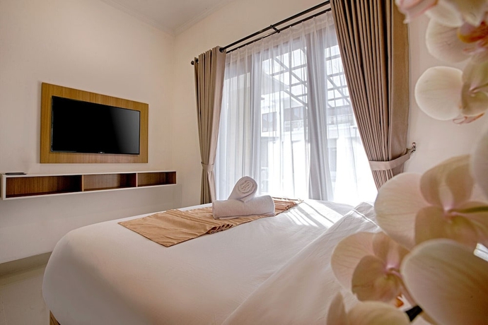 Imagen de la habitación del Hotel Taman Seminyak Suites. Foto 6