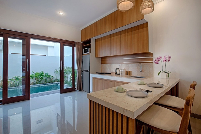 Imagen de la habitación del Hotel Taman Seminyak Suites. Foto 7