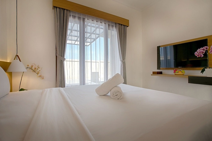 Imagen de la habitación del Hotel Taman Seminyak Suites. Foto 8