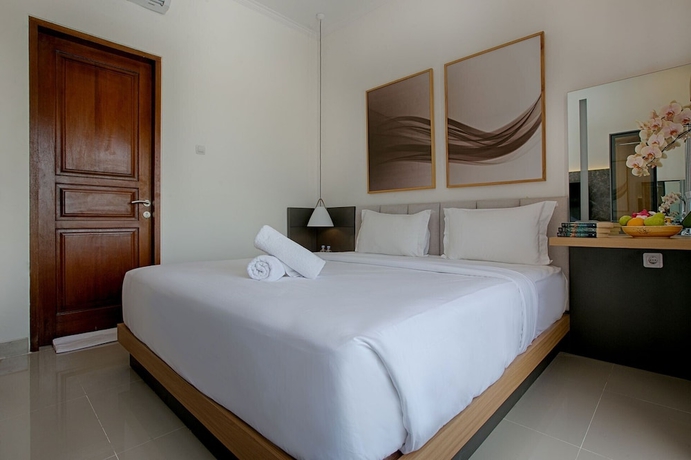 Imagen de la habitación del Hotel Taman Seminyak Suites. Foto 11