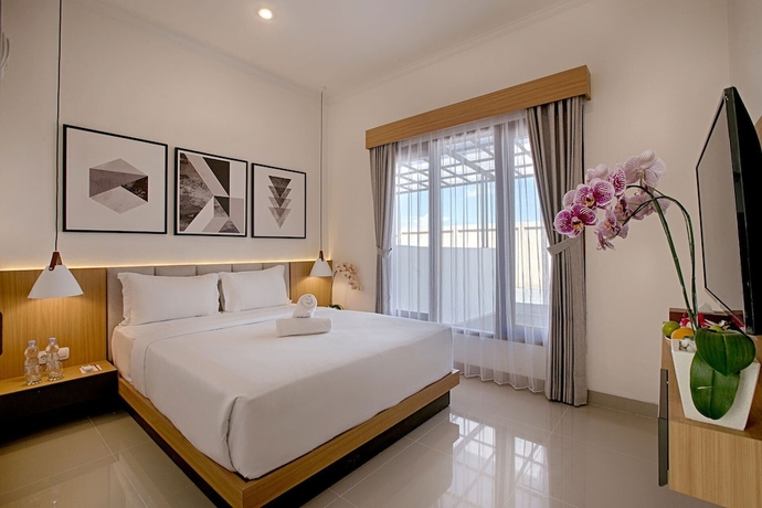 Imagen de la habitación del Hotel Taman Seminyak Suites. Foto 12